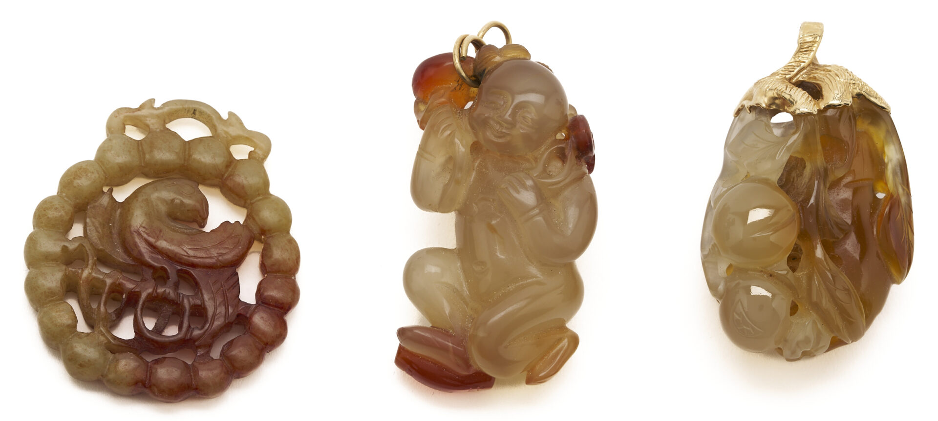 Lot 36: 7 Gold & Carved Nephrite Jade Pendants