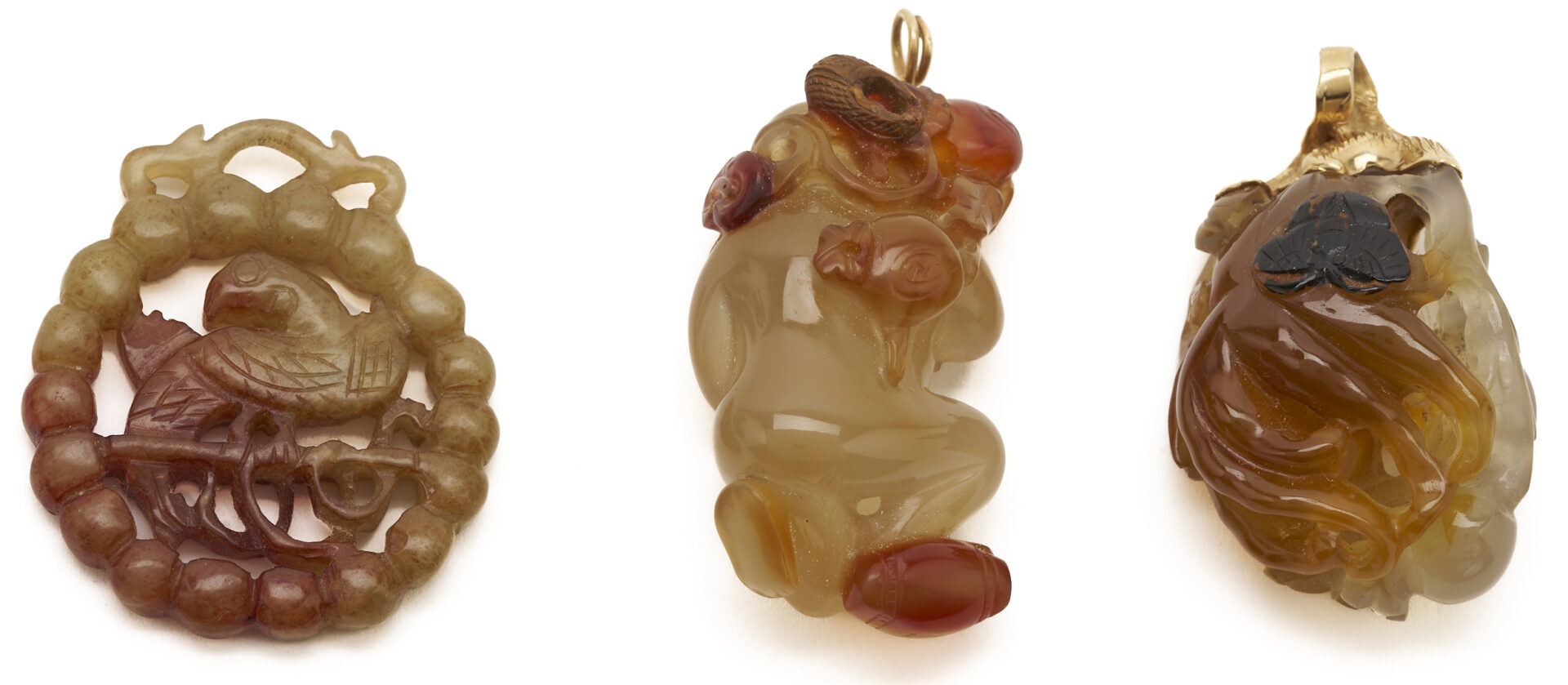 Lot 36: 7 Gold & Carved Nephrite Jade Pendants