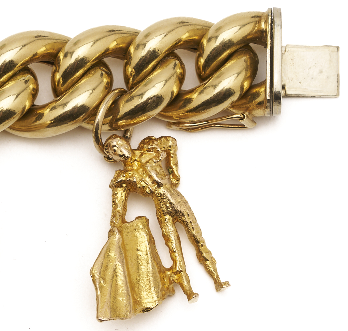 Lot 40: 18K Gold Charm Bracelet