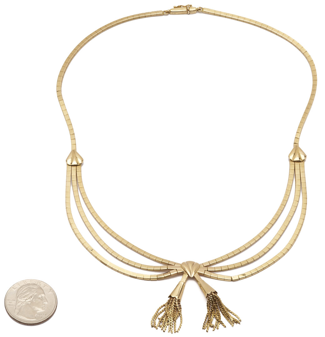 Lot 62: 18K Gold Bow Necklace