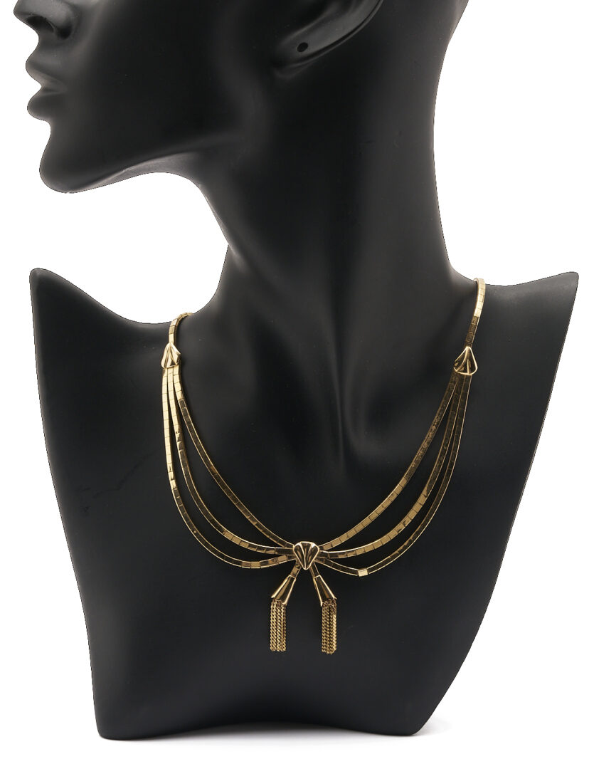 Lot 62: 18K Gold Bow Necklace