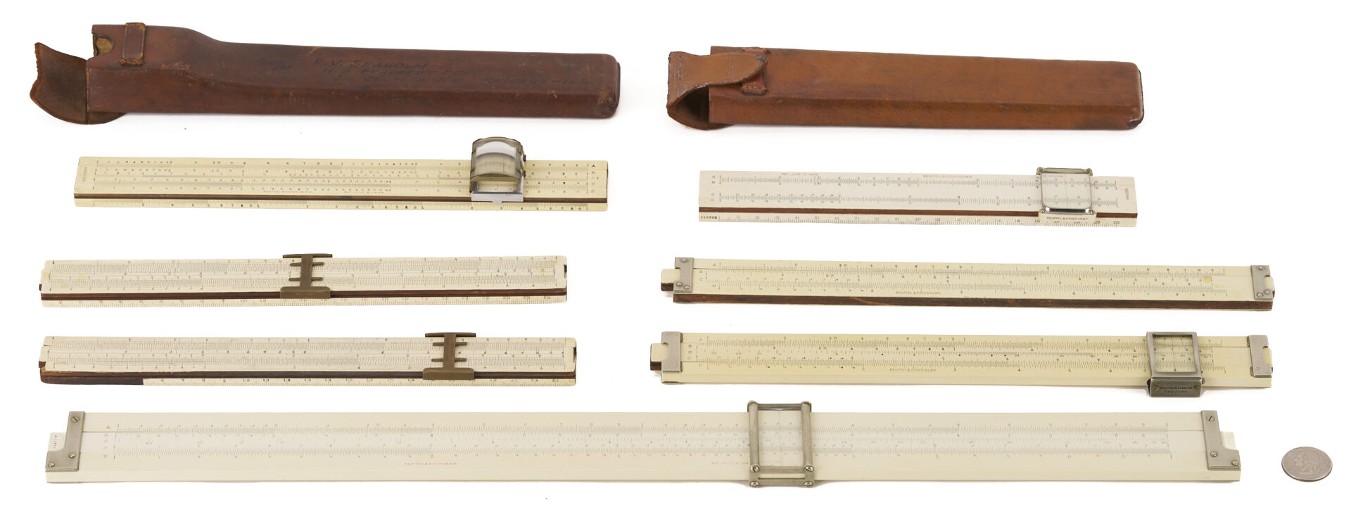 Lot 676: Grouping of 7 Keuffel & Esser Slide Rules; K&E