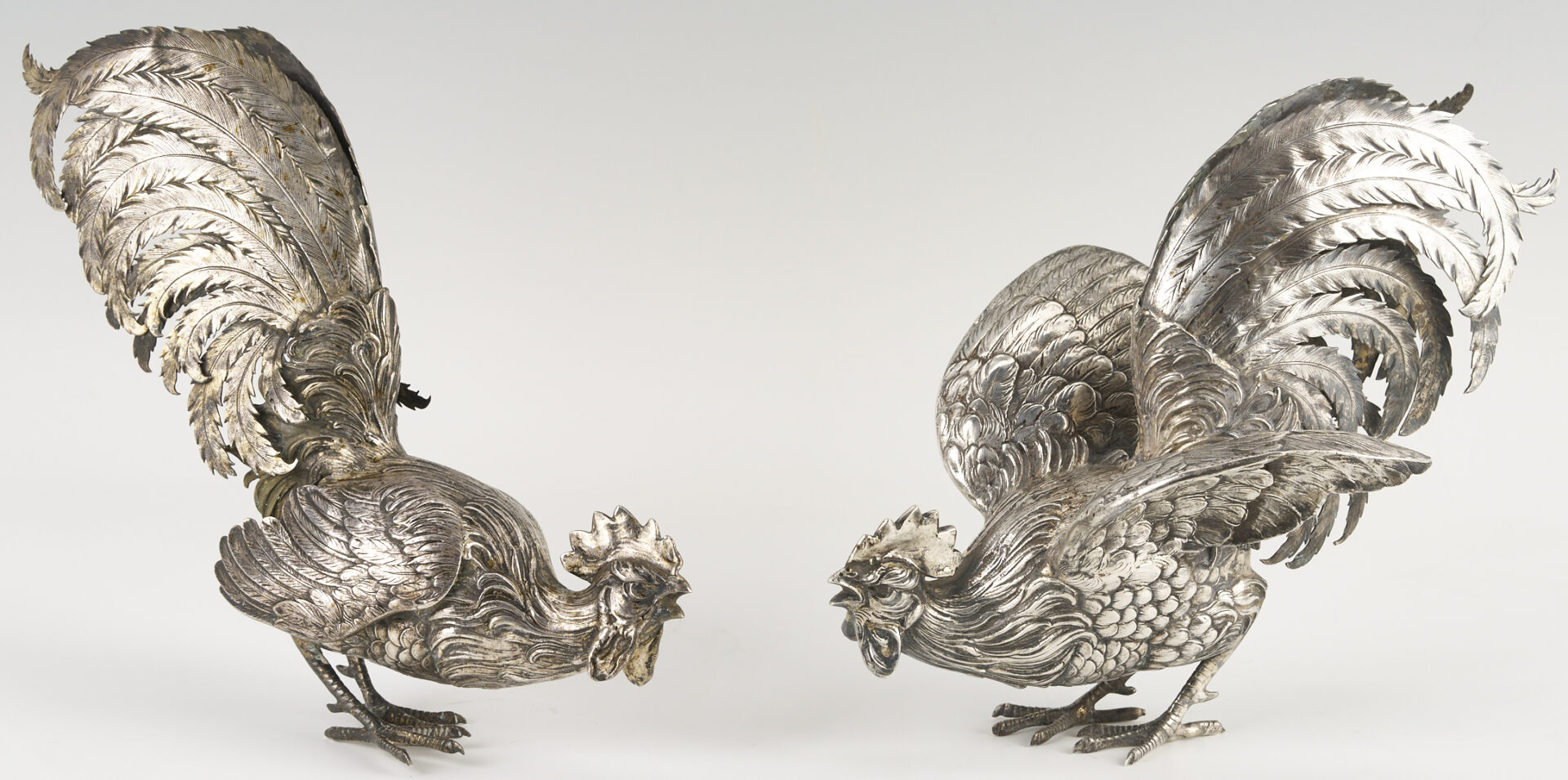 Lot 71: Pair of .800 Silver Fighting Cockerel Figures