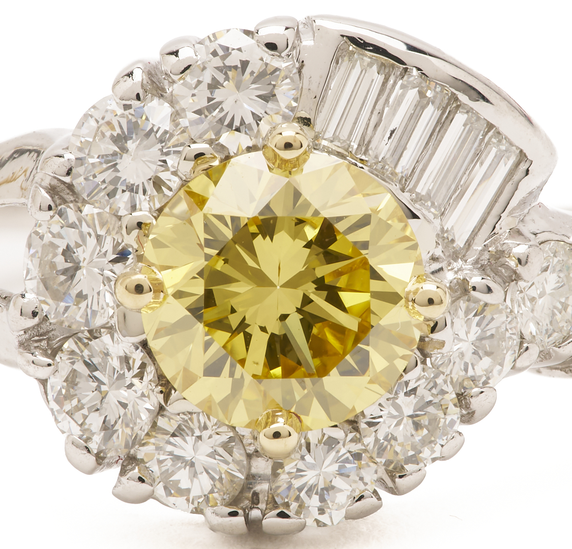 Lot 794: Yellow Diamond Ring w/ White Diamond Setting, GIA Report