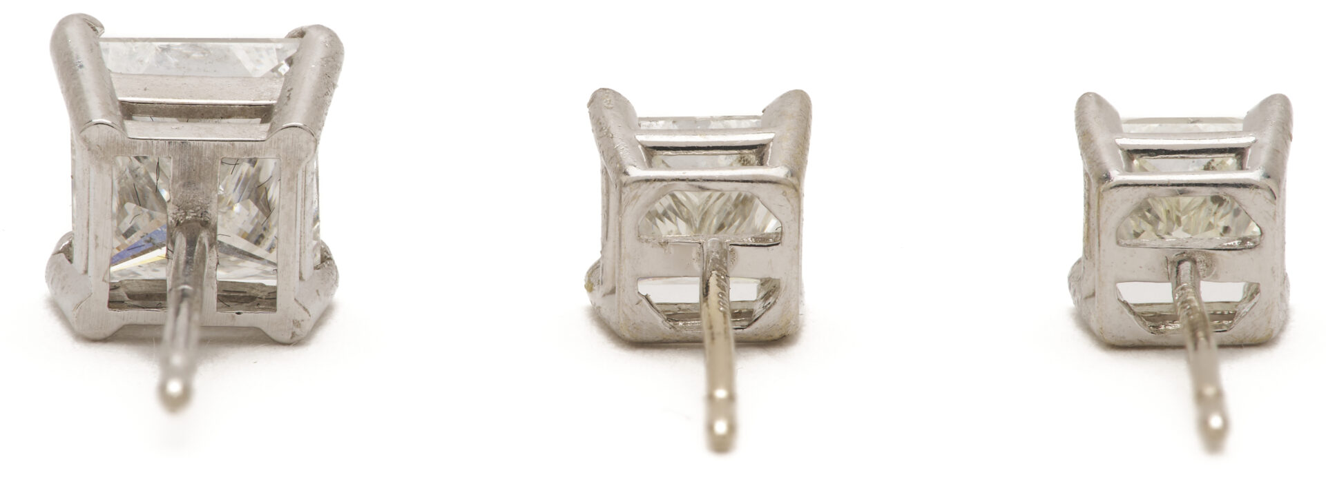 Lot 823: Three 14K Gold & Diamond Stud Earrings