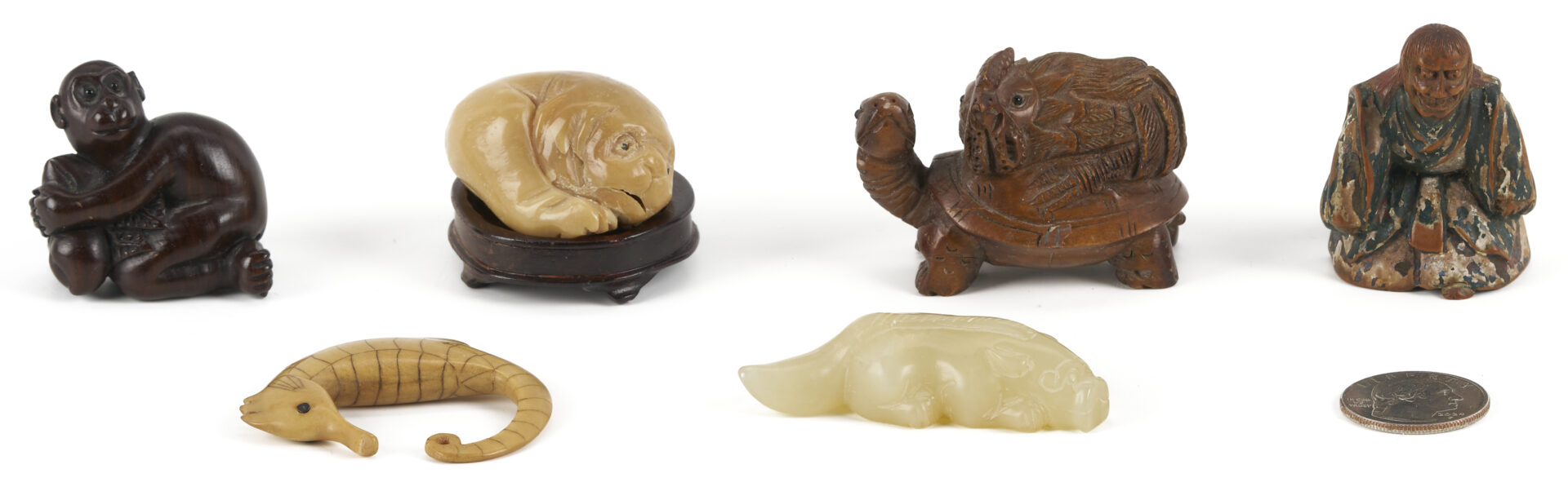 Lot 882: 11 Asian Deocrative Items. incl. Netsukes and More