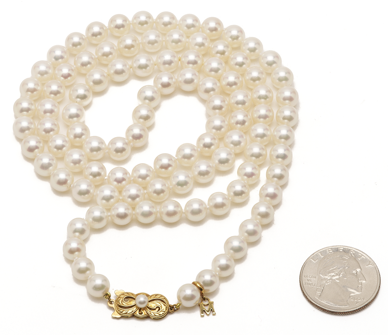 Lot 951: Ladies’ Mikimoto Pearl Necklace, 18K Gold Clasp