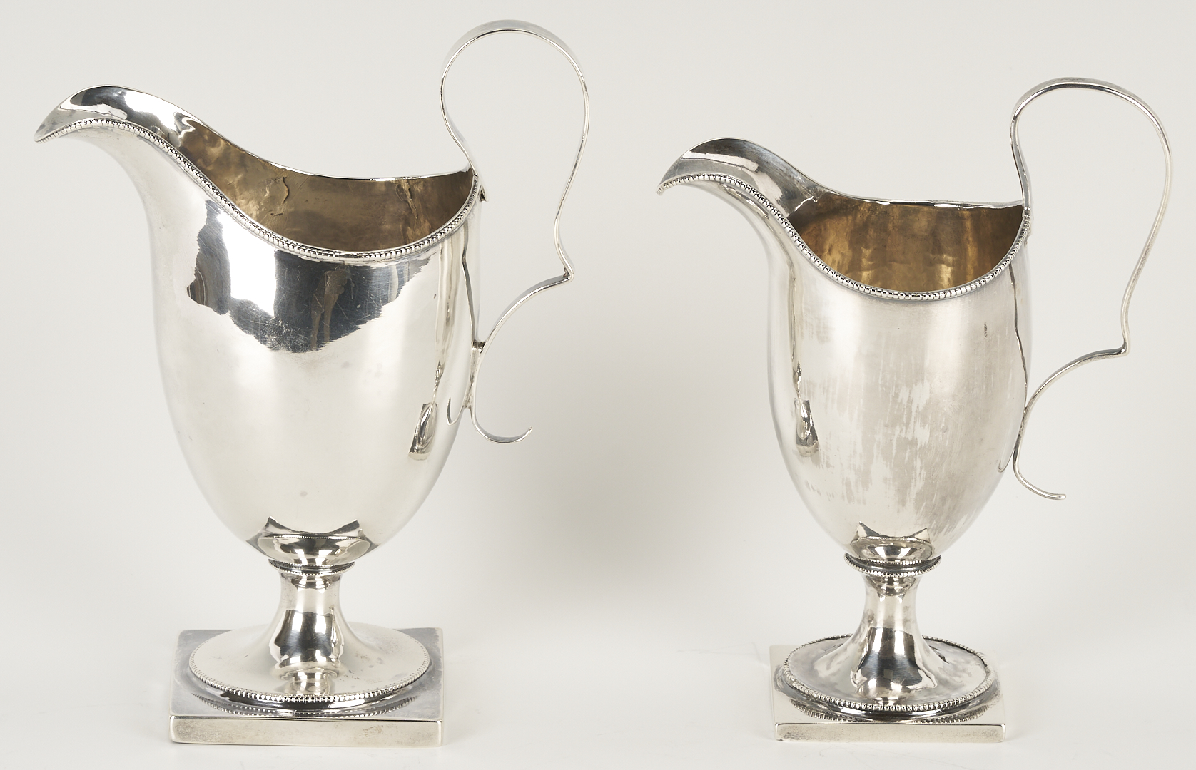 Lot 998: American Coin Silver Ladle, attrib. William Ward Jr. and 2 American Coin Silver Creamers, Joseph Shoemaker