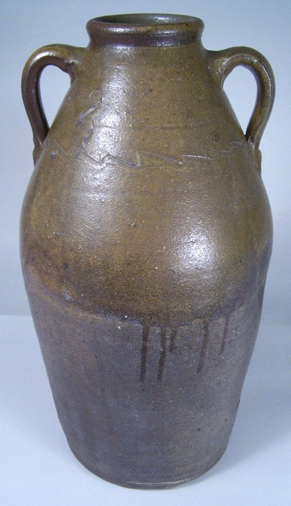 Lot 100: Greene County, Tennessee redware jar attributed to C A Haun