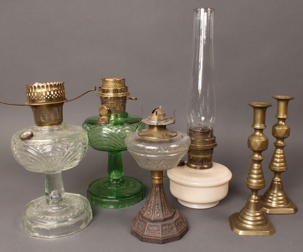 Lot 688A: Grouping of oil lamps and brass candlesticks