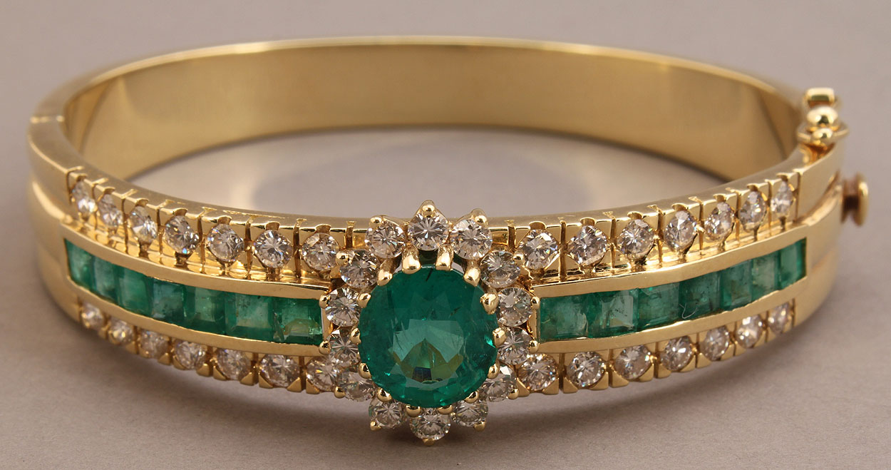 Lot 154: 18K Natural Emerald and Diamond bangle bracelet