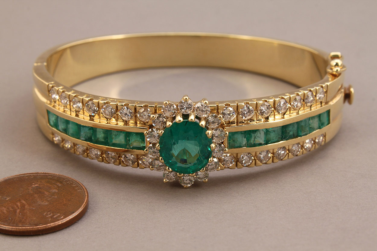Lot 154: 18K Natural Emerald and Diamond bangle bracelet