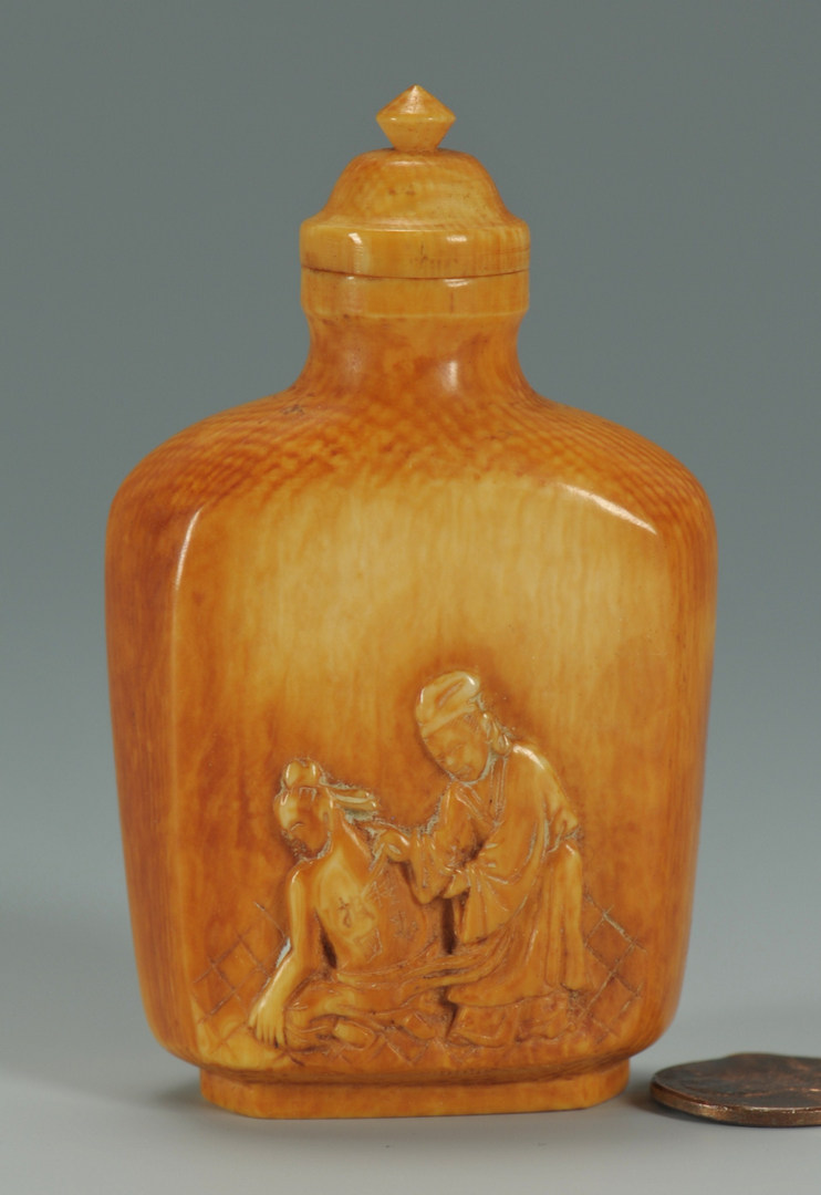 Lot 16: Stained ivory snuff bottle – filial piety theme