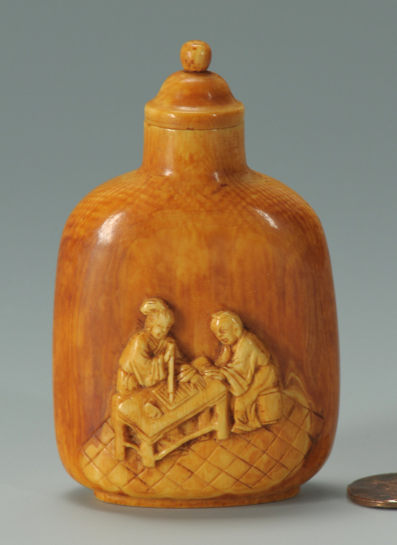 Lot 17: Stained ivory snuff bottle – calligraphy theme