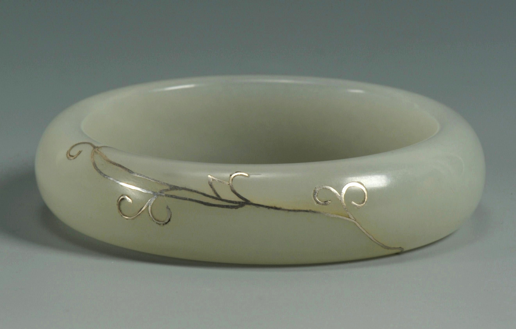 Lot 182: Chinese Celadon Jade Bangle w/ Silver Inlay