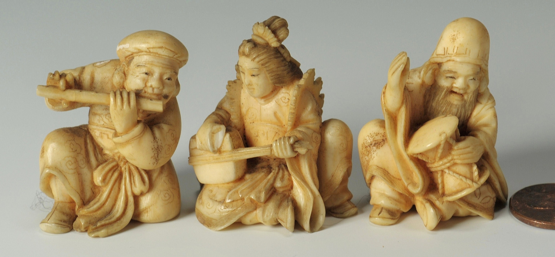 Lot 191: 3 Japanese carved ivory musician figures