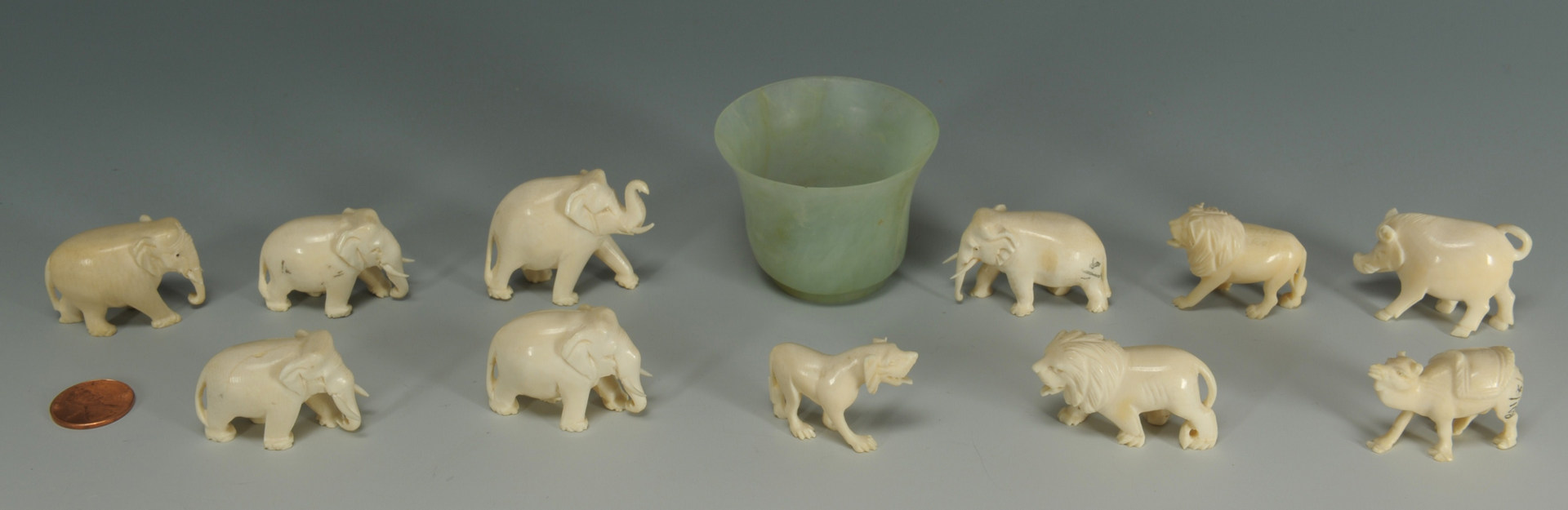 Lot 192: 11 Carved ivory animals and a Chinese jade wine cu