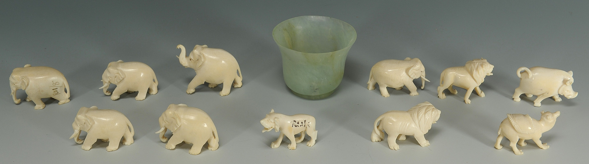 Lot 192: 11 Carved ivory animals and a Chinese jade wine cu