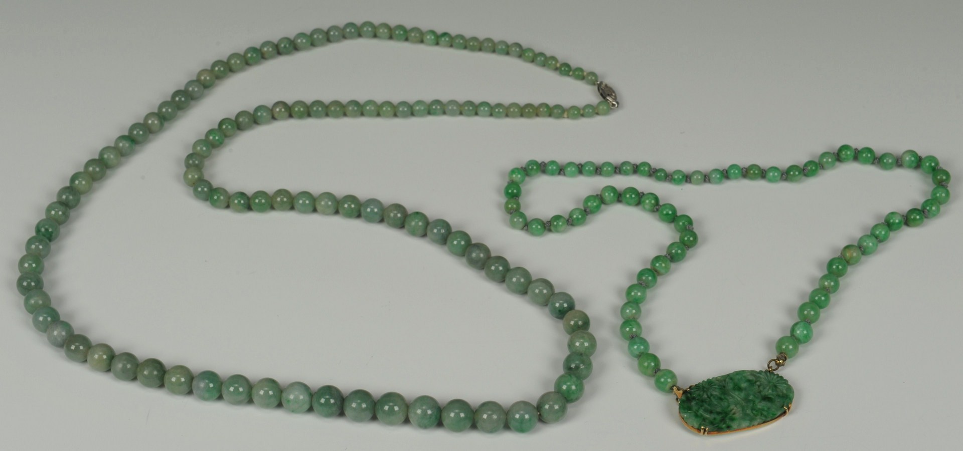 Lot 213: Two Jade and gold necklaces