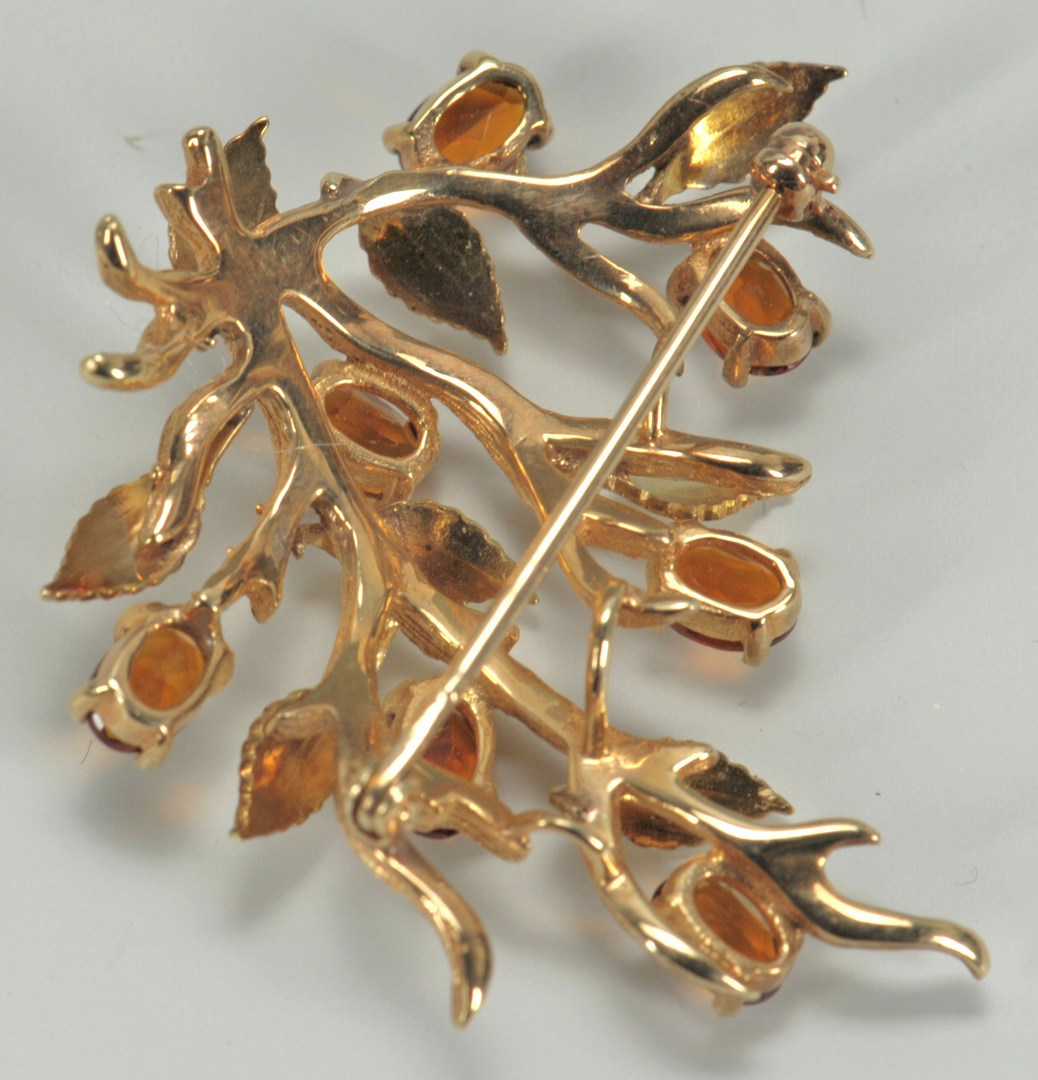 Lot 220: 14K gold branch style brooch with stone flowers