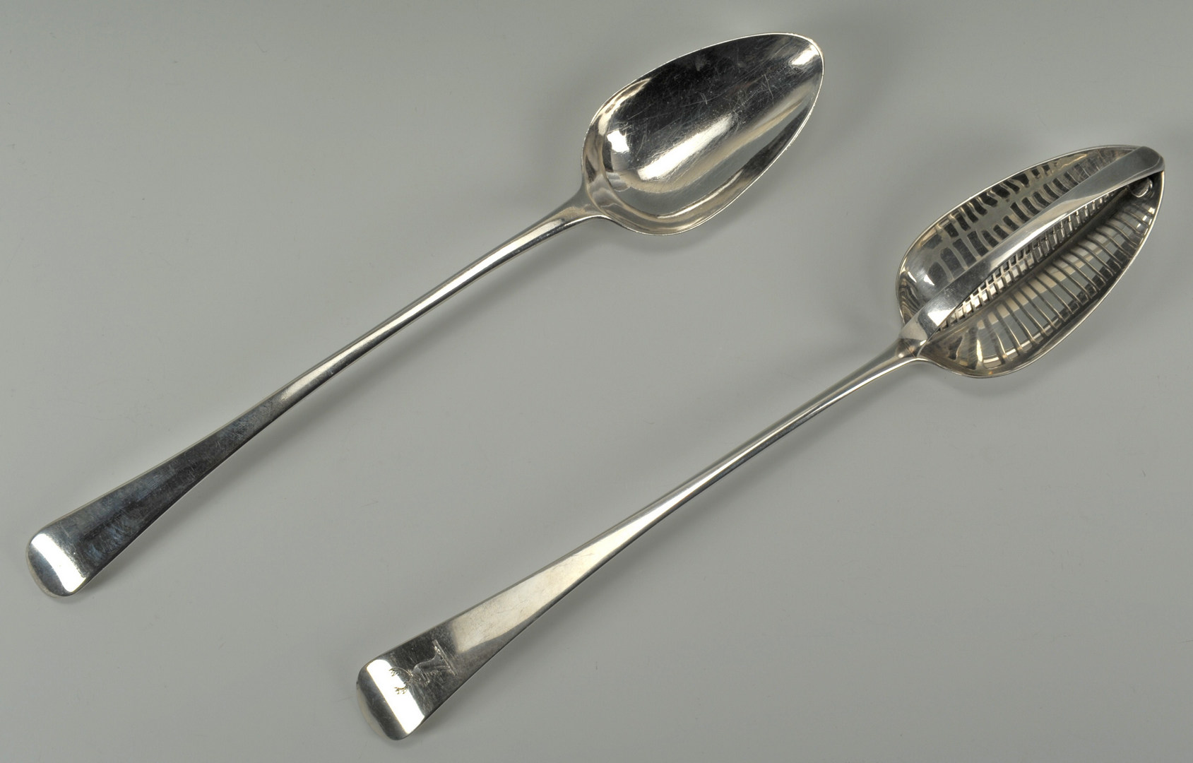 Lot 225: George III Sterling Straining & Stuffing Spoons