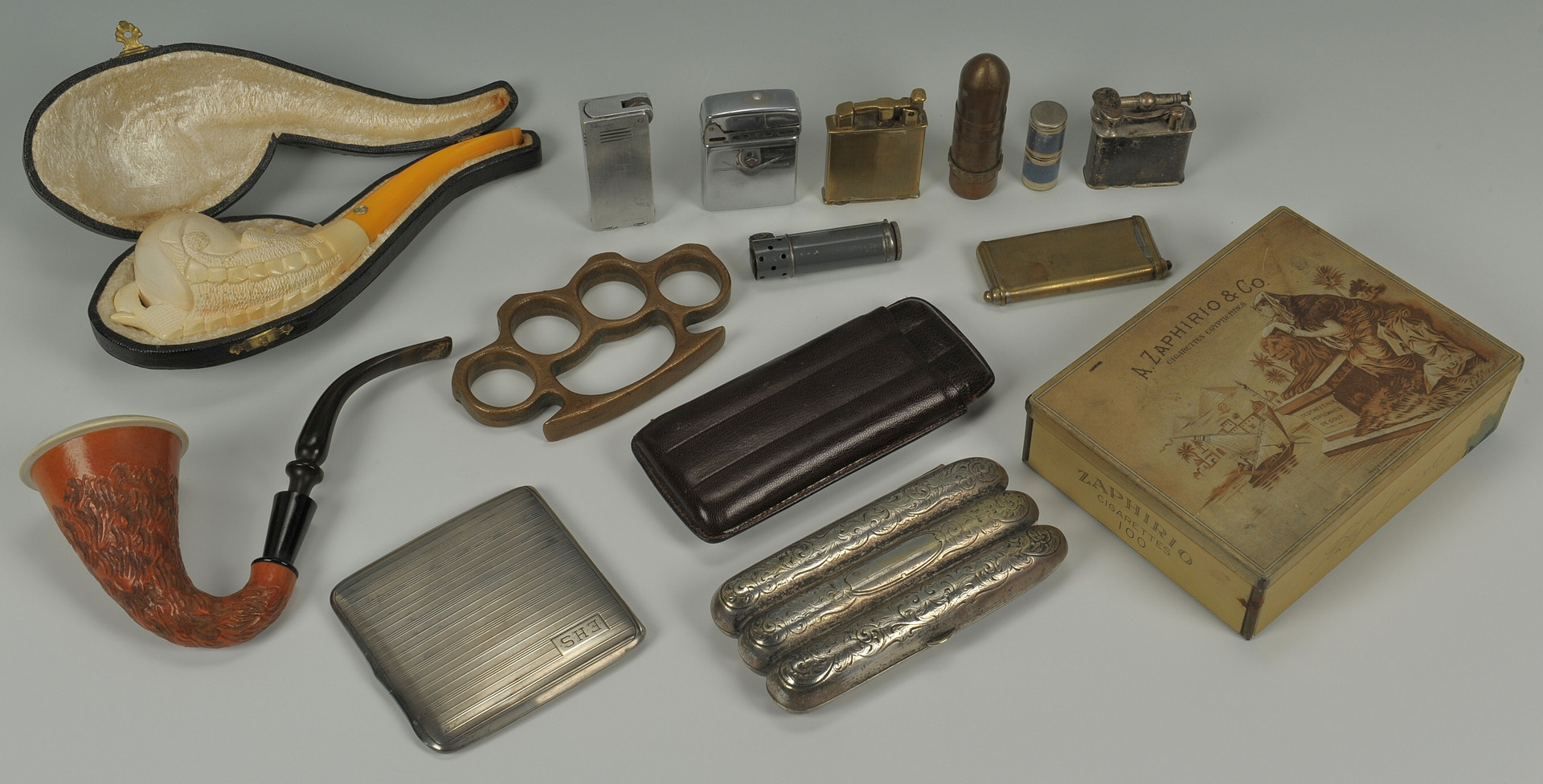 Lot 374: Lot of smoking related items and pr brass knuckles