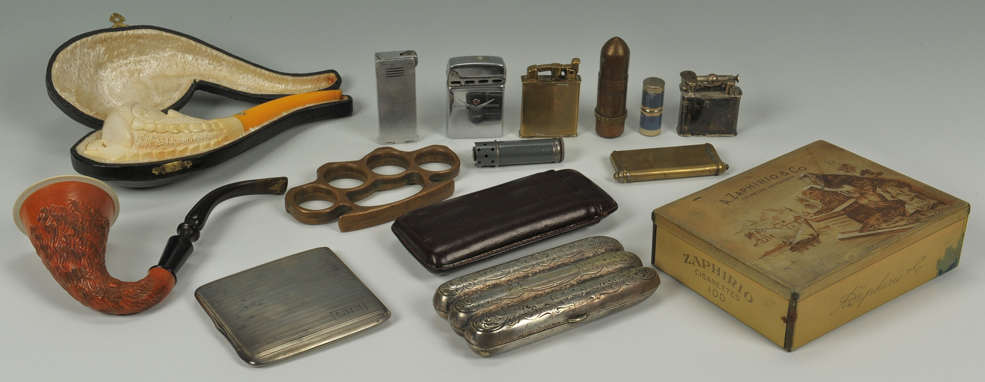 Lot 374: Lot of smoking related items and pr brass knuckles