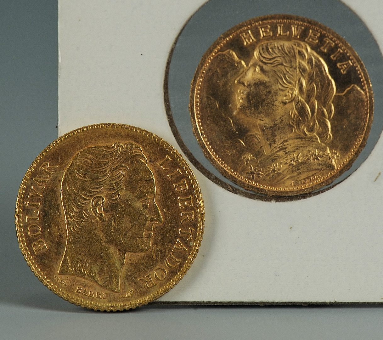 Lot 545: 2 gold coins: 1927 Swiss 20 FR; 1904 20 Bolivar