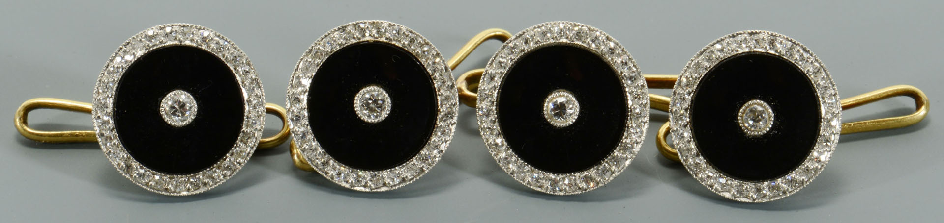 Lot 116: 4 onyx and gold Dress Studs, retailed by Tiffany