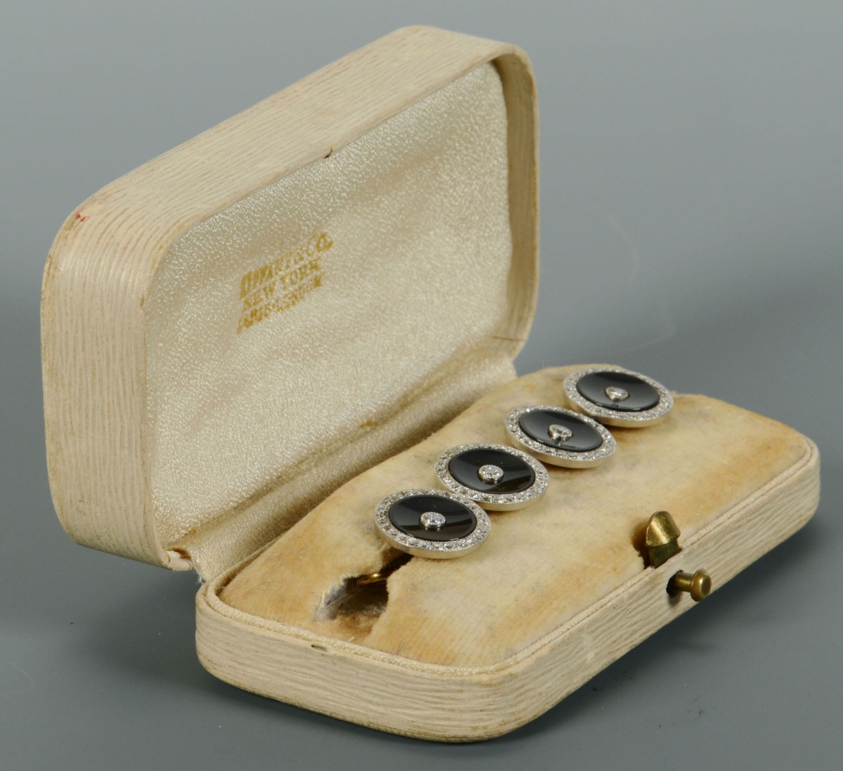 Lot 116: 4 onyx and gold Dress Studs, retailed by Tiffany