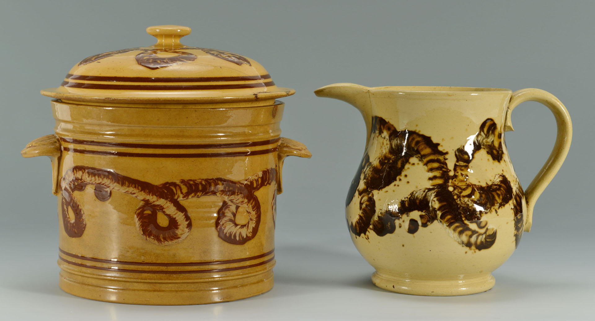 Lot 144: Yellowware Mocha Earthworm jar and pitcher