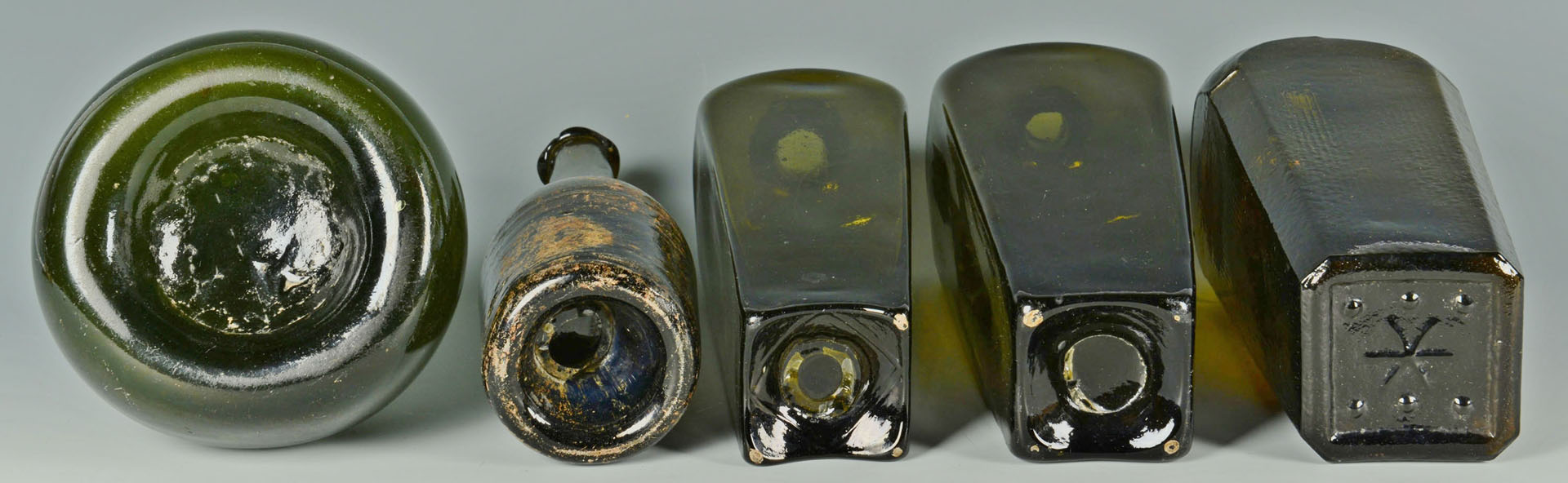 Lot 159: 5 Colored wine & gin bottles, 18th/19th c.