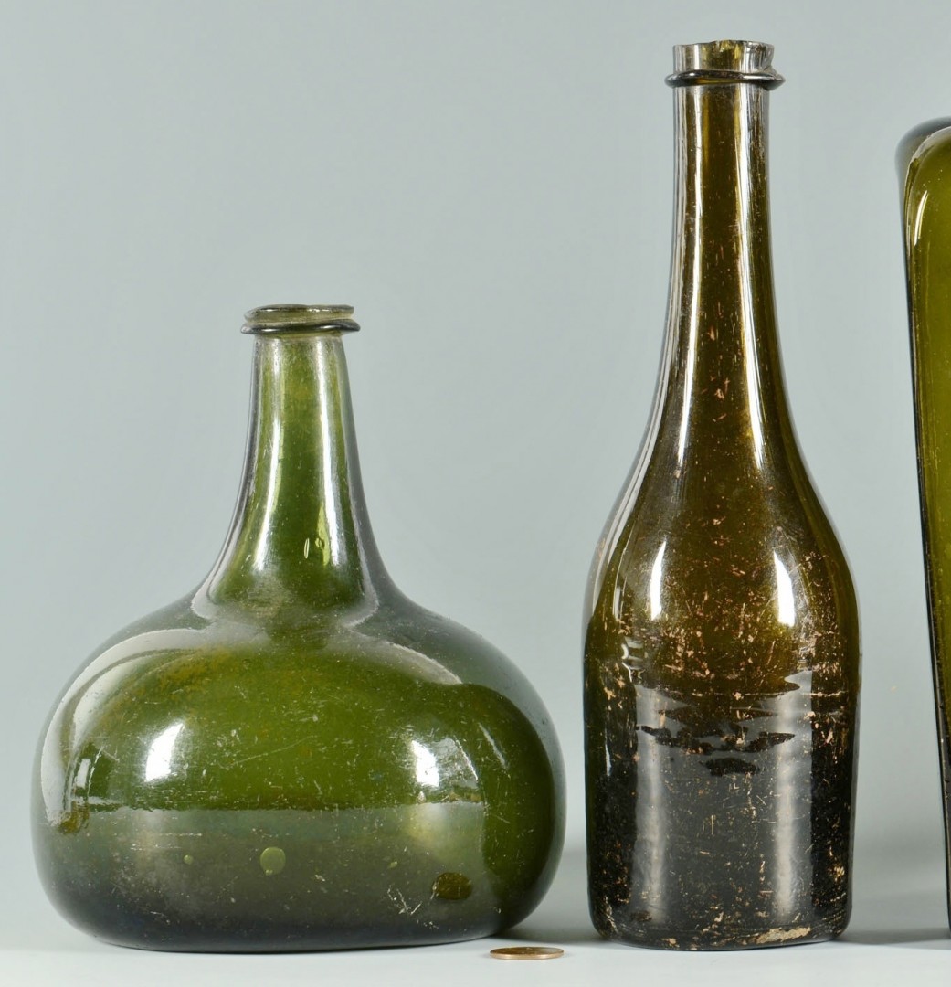 Lot 159: 5 Colored wine & gin bottles, 18th/19th c.
