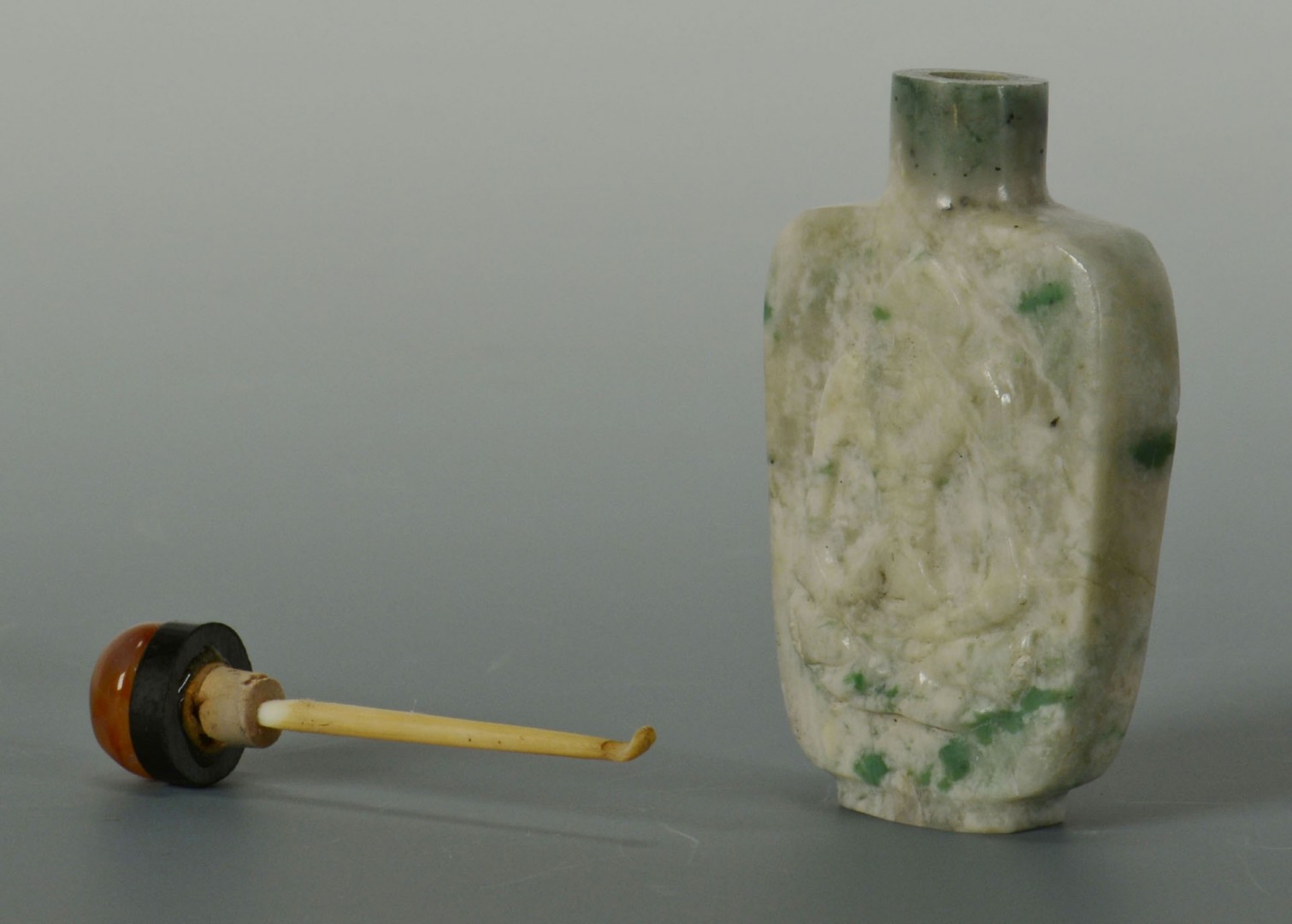 Lot 16: Chinese Carved Green and White Jade snuff bottle