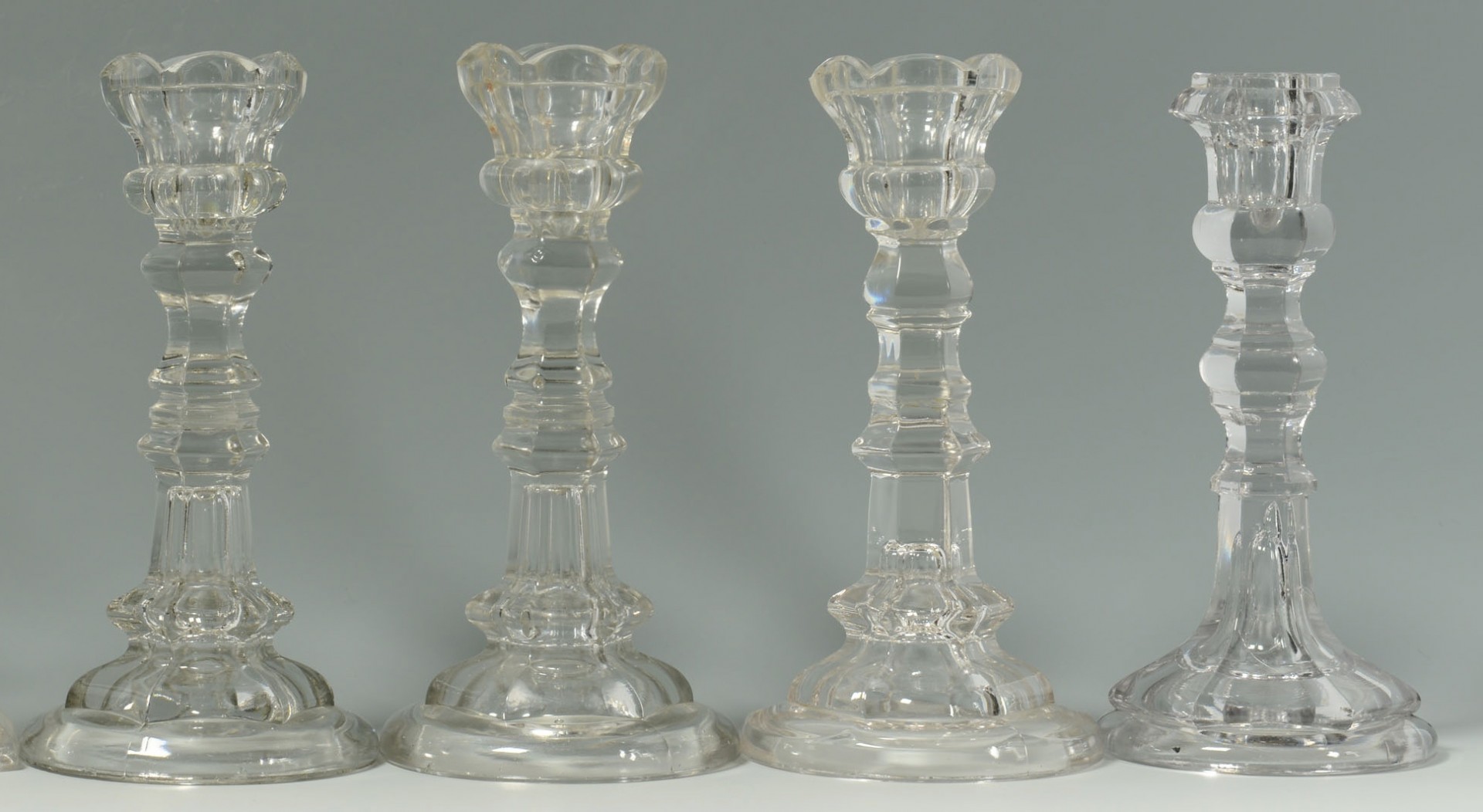 Lot 173: 10 Early Glass Candlesticks & Oil Peg Lamps