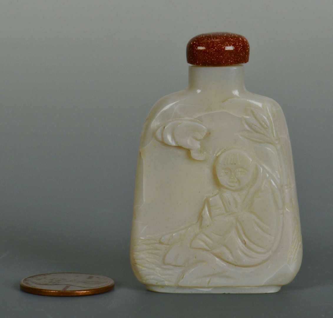 Lot 17: Chinese Qing Carved White Jade Snuff Bottle