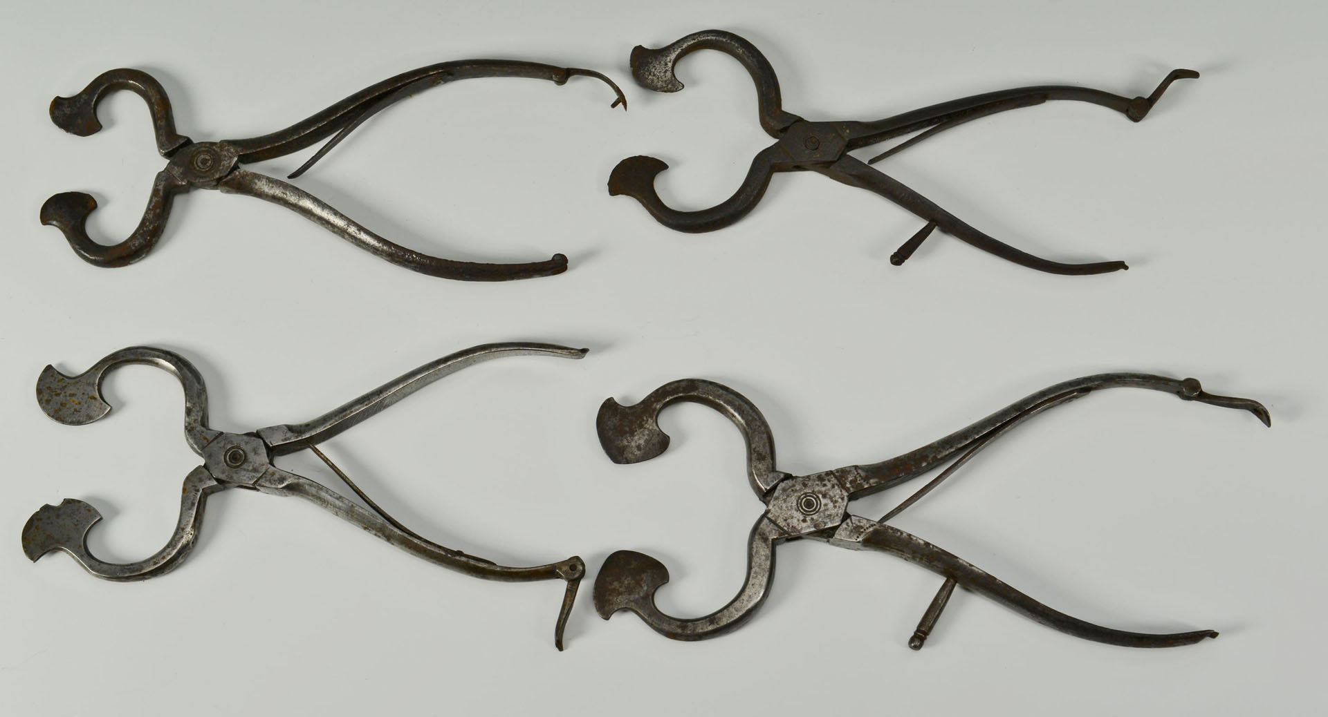 Lot 325: Grouping of 4 early iron sugar nips, some engraved