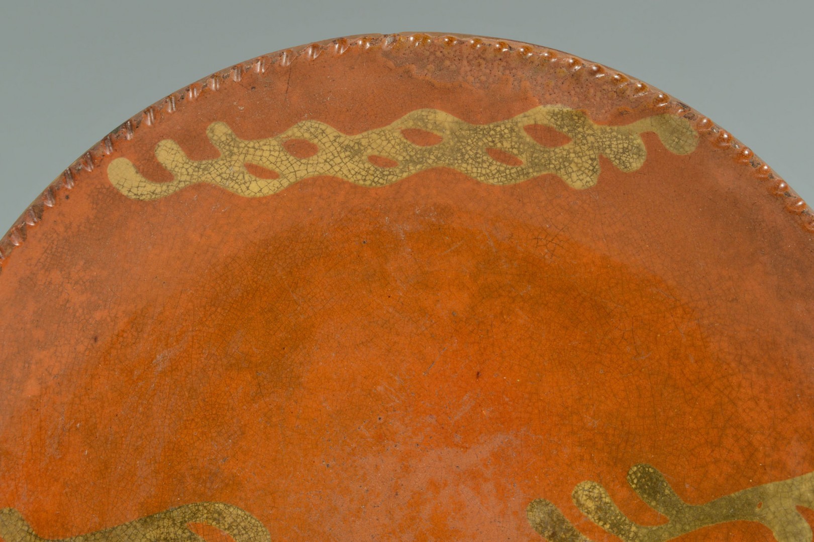 Lot 459: Pair of 19th c. slip decorated redware plates