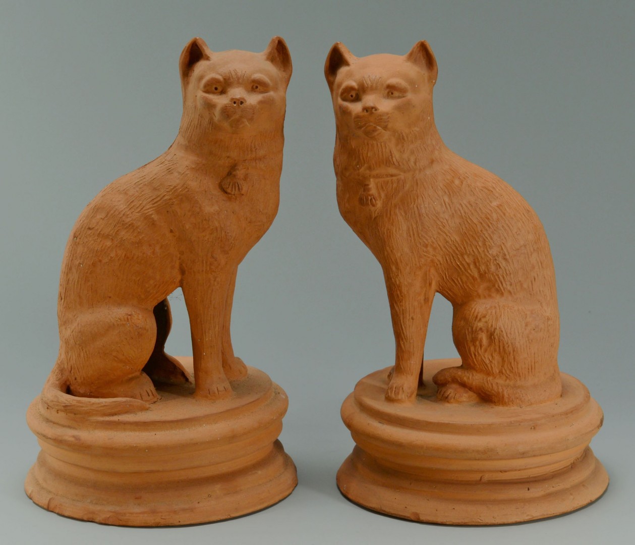 Lot 462: Pair of Terra Cotta Cats and 2 Cow Creamers