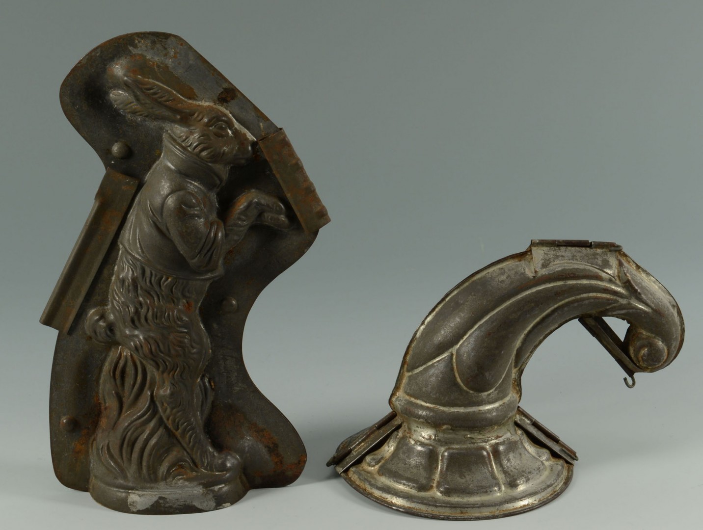 Lot 543: Early Tin Chocolate Molds and Large Cookie Cutters