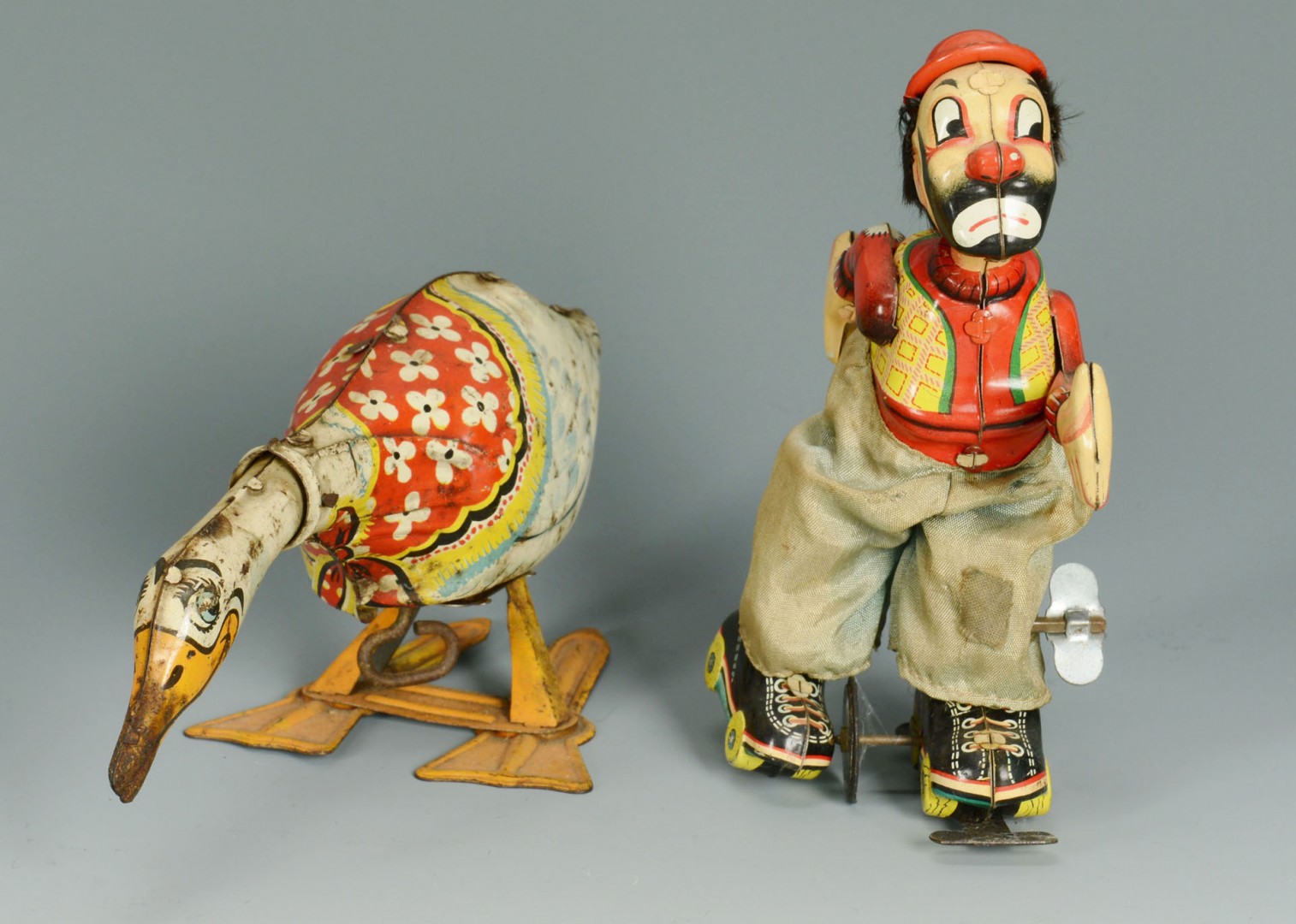 Lot 591: 4 Lithographed Tin Toys