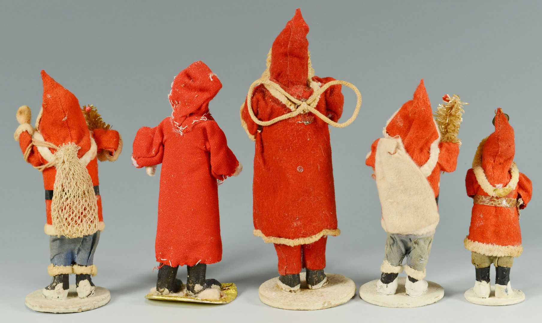 Lot 595: Grouping of five (5) early standing Santa figures