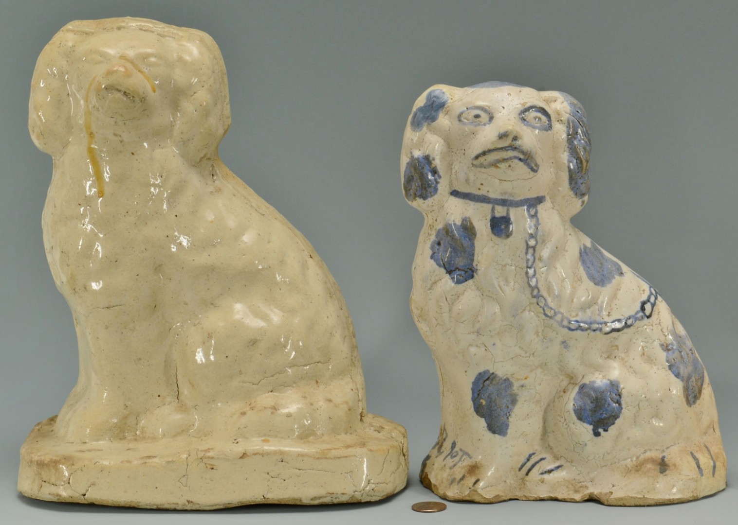 Lot 61: Grouping of 4 Sewer Tile Spaniel Dogs