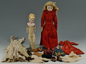 Lot 680: 2 Early Bisque Head Fashion dolls and extra clothe
