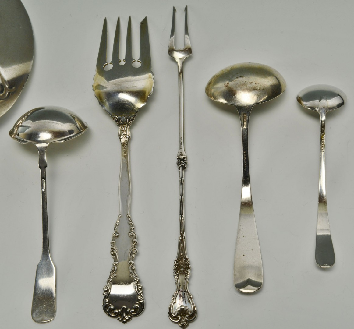 Lot 726: 8 American Sterling serving pieces, early patterns