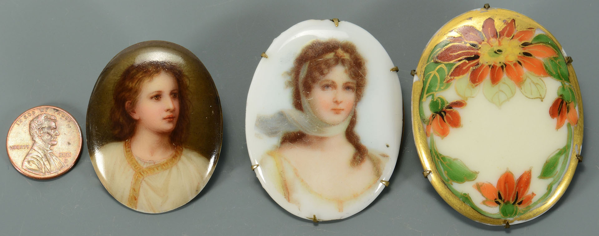 Lot 741: Three miniature paintings on porcelain inc. 2 pins