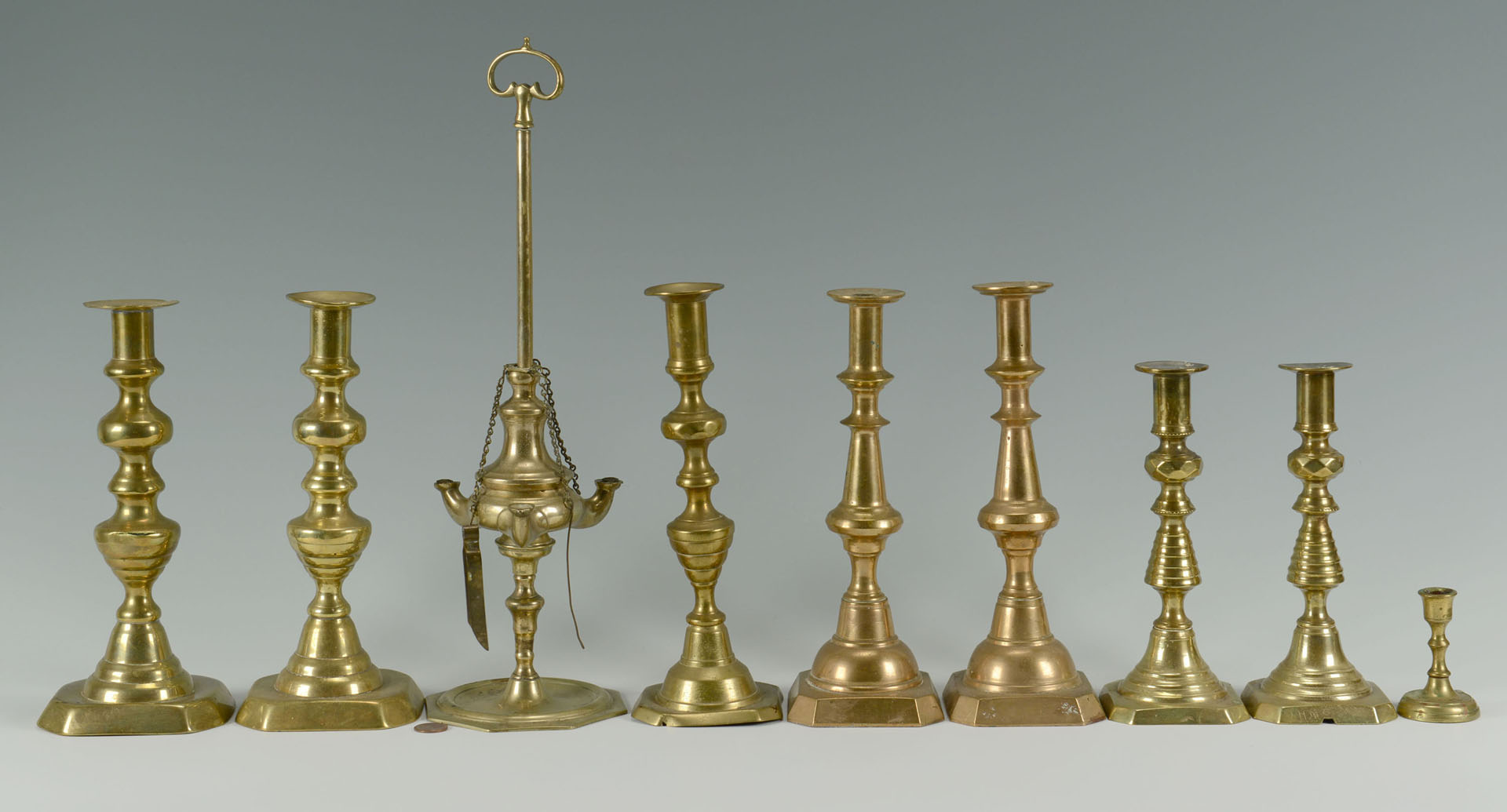 Lot 756: Grouping of Brass Candlesticks, 19th c.