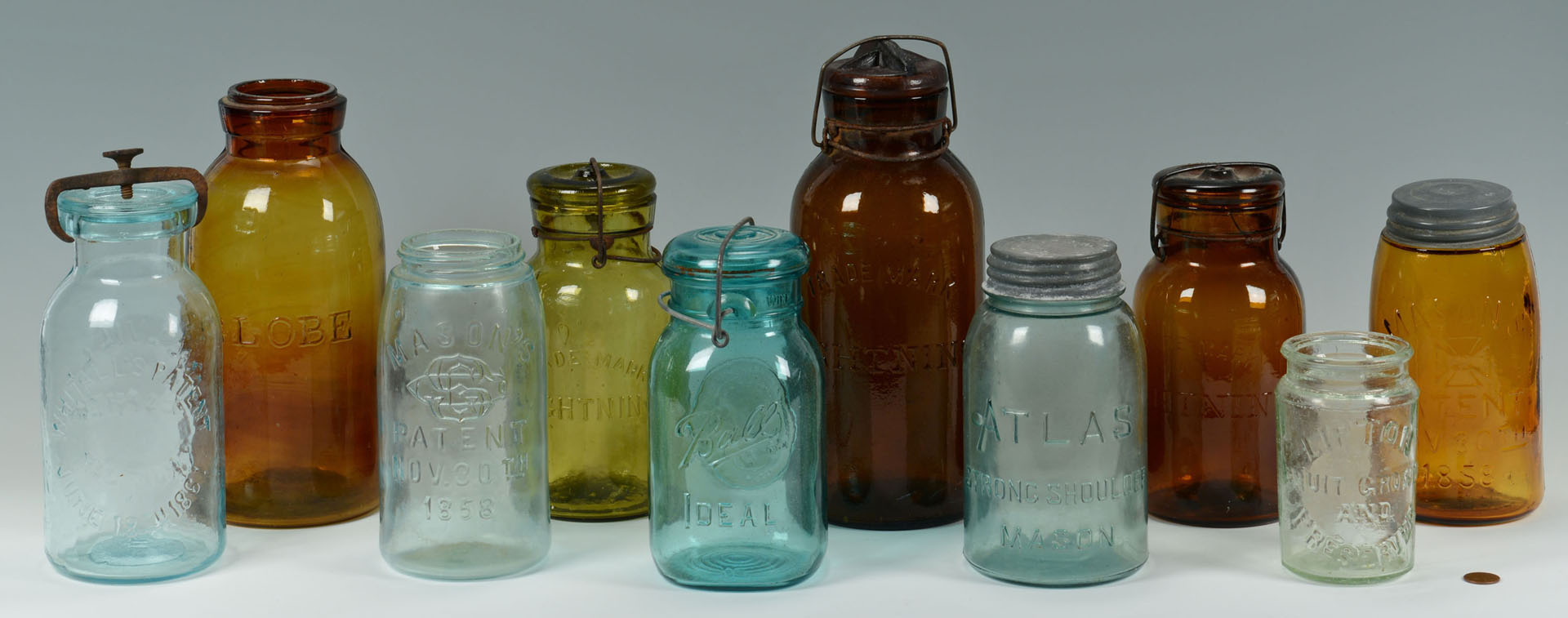 Lot 757: Grouping of 10 Early Canning Jars & water bottle