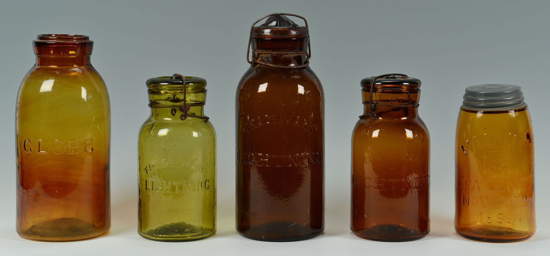 Lot 757: Grouping of 10 Early Canning Jars & water bottle