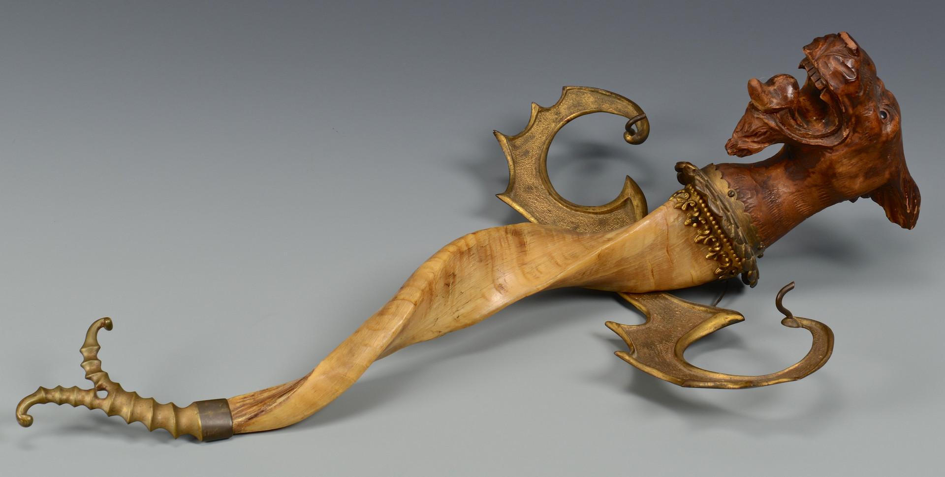 Lot 23: Carved Griffin & Decorative Brass